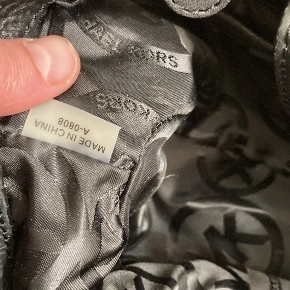 Michael kors mini black leather drawstring bag